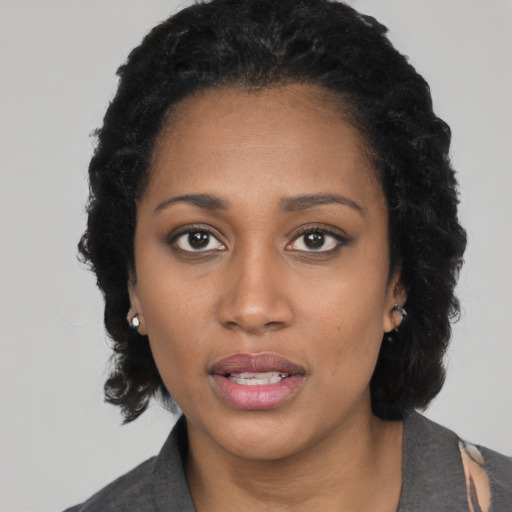 Neutral black young-adult female with short  black hair and brown eyes