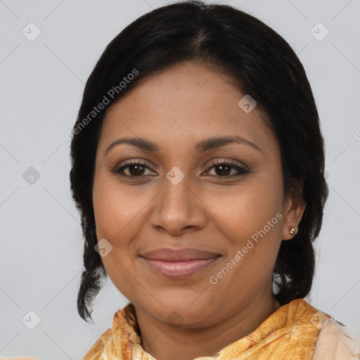 Joyful black adult female with medium  brown hair and brown eyes