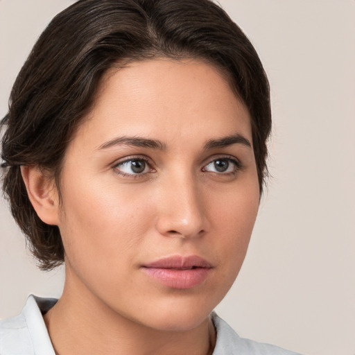 Neutral white young-adult female with medium  brown hair and brown eyes