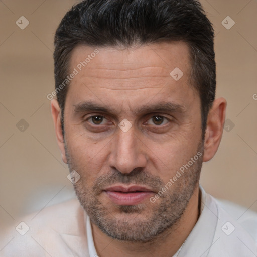 Joyful white adult male with short  brown hair and brown eyes