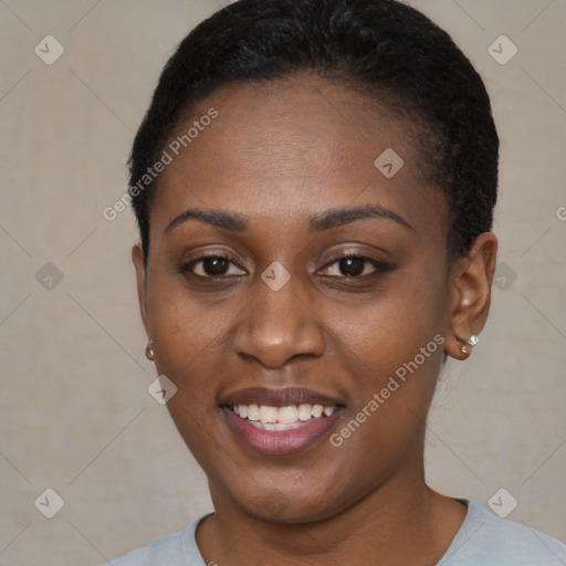 Joyful black young-adult female with short  brown hair and brown eyes