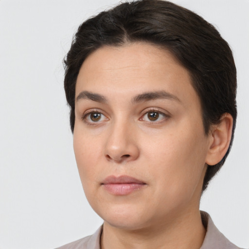 Neutral white young-adult female with short  brown hair and brown eyes