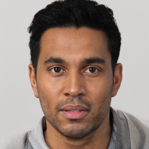 Neutral black young-adult male with short  black hair and brown eyes