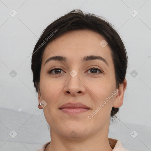 Joyful white young-adult female with short  brown hair and brown eyes