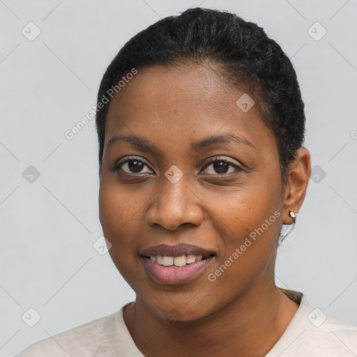 Joyful black young-adult female with short  black hair and brown eyes
