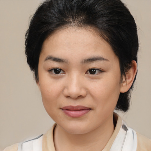Joyful white young-adult female with medium  brown hair and brown eyes