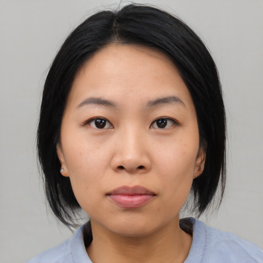 Neutral asian young-adult female with medium  black hair and brown eyes