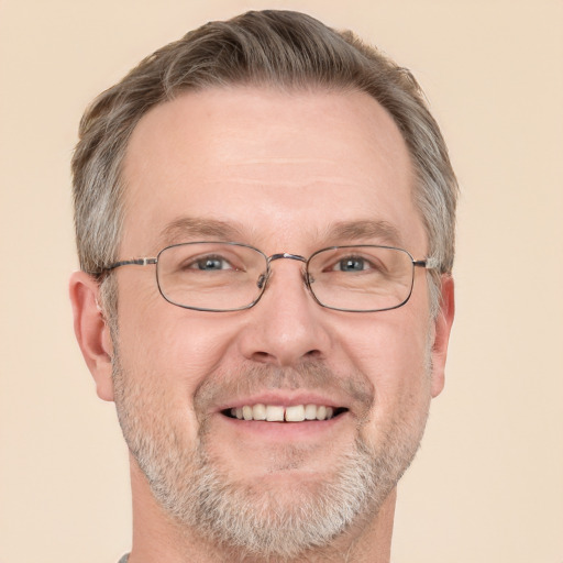 Joyful white middle-aged male with short  brown hair and grey eyes