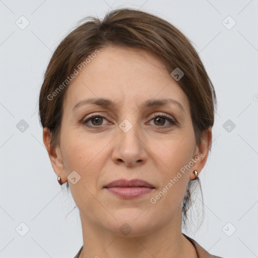 Joyful white adult female with medium  brown hair and grey eyes