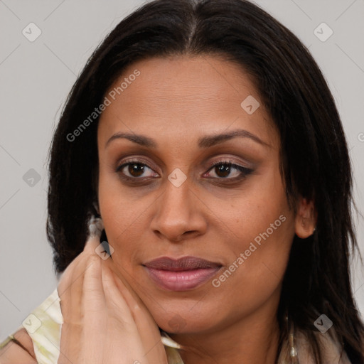 Joyful latino young-adult female with long  brown hair and brown eyes