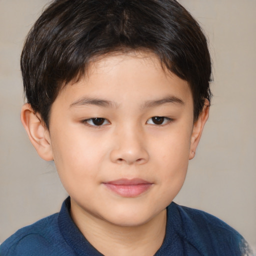 Joyful asian child male with medium  brown hair and brown eyes