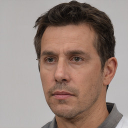 Neutral white adult male with short  brown hair and brown eyes