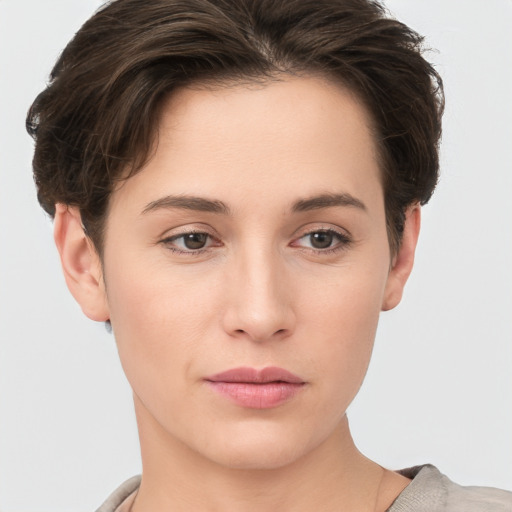 Neutral white young-adult female with short  brown hair and brown eyes