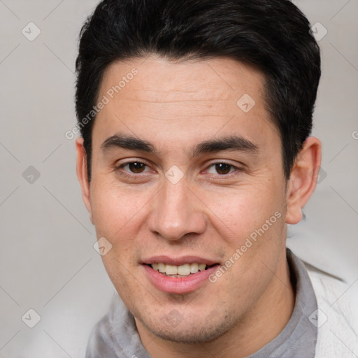 Joyful white young-adult male with short  brown hair and brown eyes