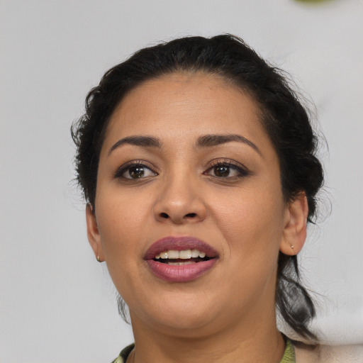 Joyful latino young-adult female with medium  black hair and brown eyes