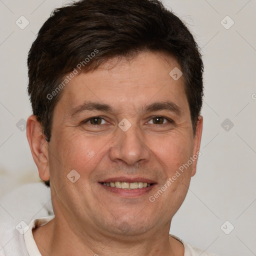 Joyful white adult male with short  brown hair and brown eyes