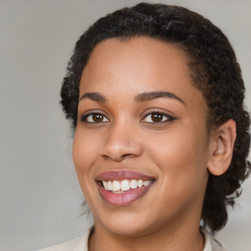 Joyful latino young-adult female with medium  black hair and brown eyes