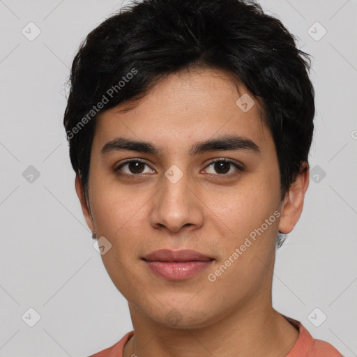 Joyful white young-adult male with short  black hair and brown eyes