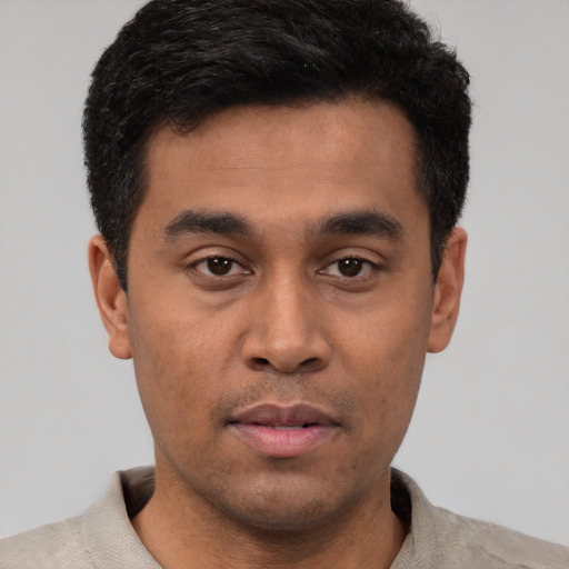 Neutral latino young-adult male with short  black hair and brown eyes