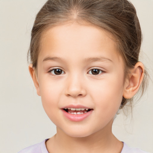 Joyful white child female with medium  brown hair and brown eyes