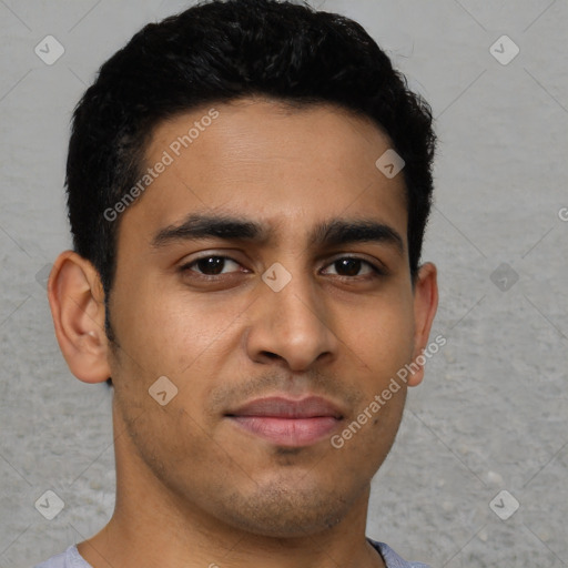 Joyful latino young-adult male with short  brown hair and brown eyes