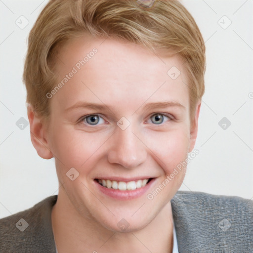 Joyful white young-adult female with short  brown hair and blue eyes