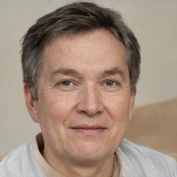 Joyful white middle-aged male with short  brown hair and brown eyes