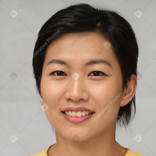 Joyful asian young-adult female with medium  brown hair and brown eyes