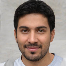 Joyful white young-adult male with short  black hair and brown eyes