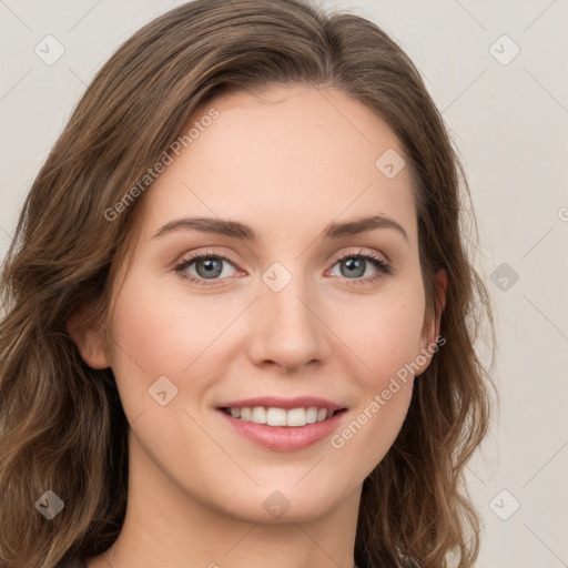 Joyful white young-adult female with long  brown hair and green eyes