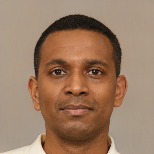 Neutral black young-adult male with short  black hair and brown eyes