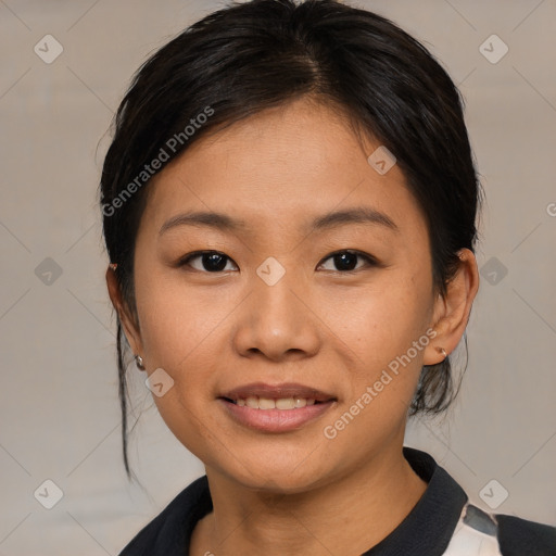 Joyful asian young-adult female with medium  black hair and brown eyes