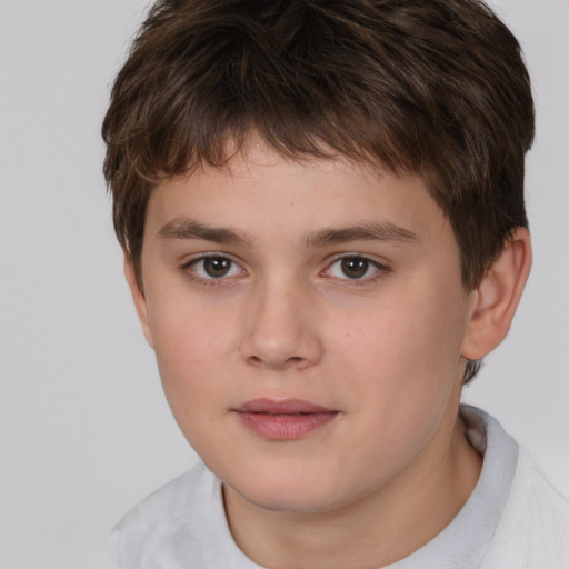 Joyful white child male with short  brown hair and brown eyes