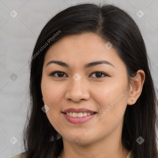 Joyful asian young-adult female with long  brown hair and brown eyes