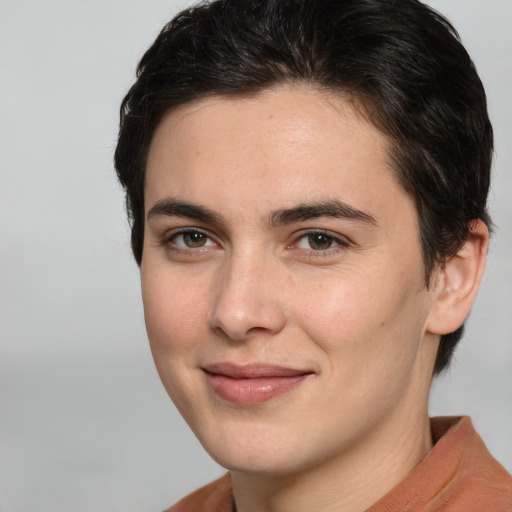 Joyful white young-adult male with medium  brown hair and brown eyes