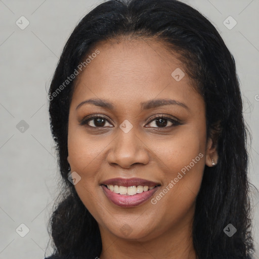 Joyful black young-adult female with long  brown hair and brown eyes