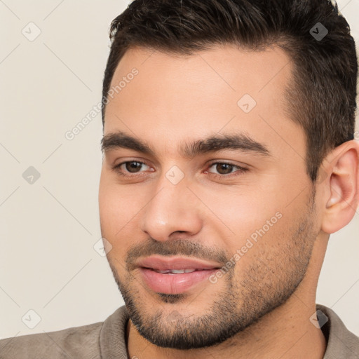 Joyful white young-adult male with short  brown hair and brown eyes