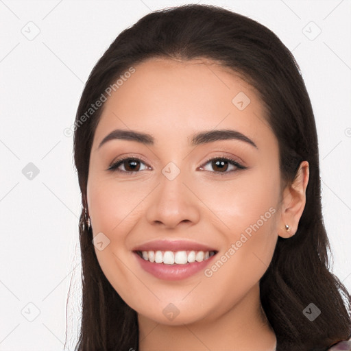 Joyful white young-adult female with long  black hair and brown eyes