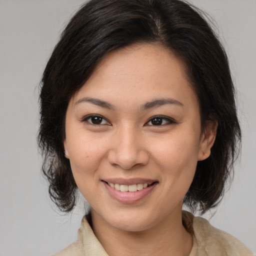 Joyful white young-adult female with medium  brown hair and brown eyes