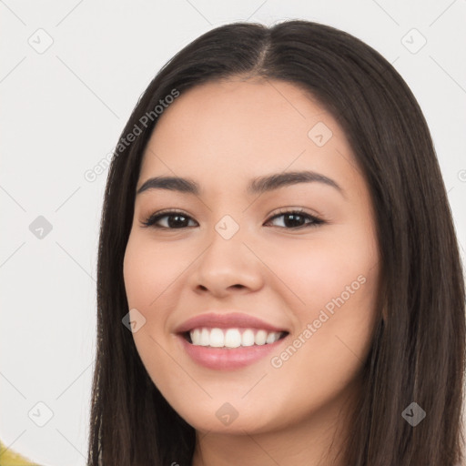 Joyful white young-adult female with long  black hair and brown eyes