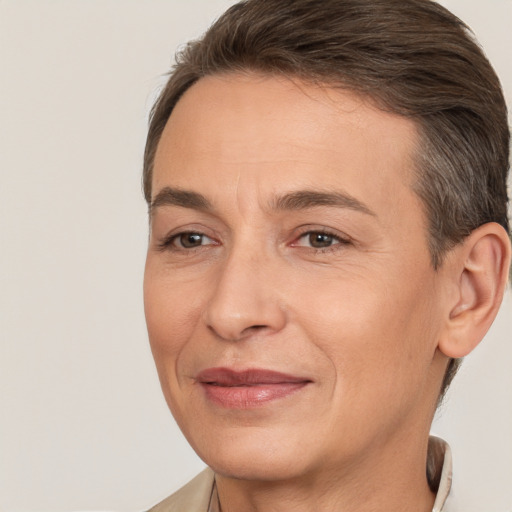 Joyful white adult female with short  brown hair and brown eyes