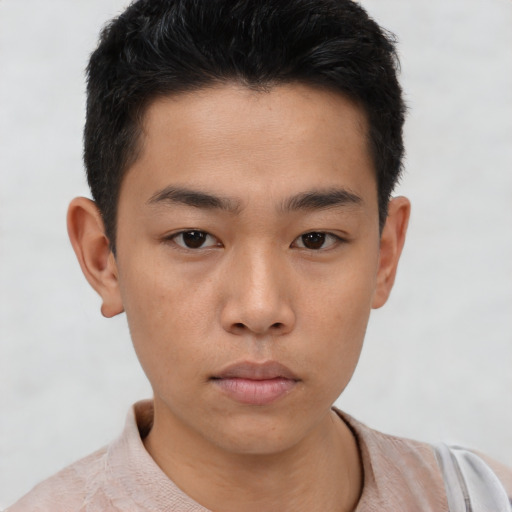 Neutral asian young-adult male with short  brown hair and brown eyes