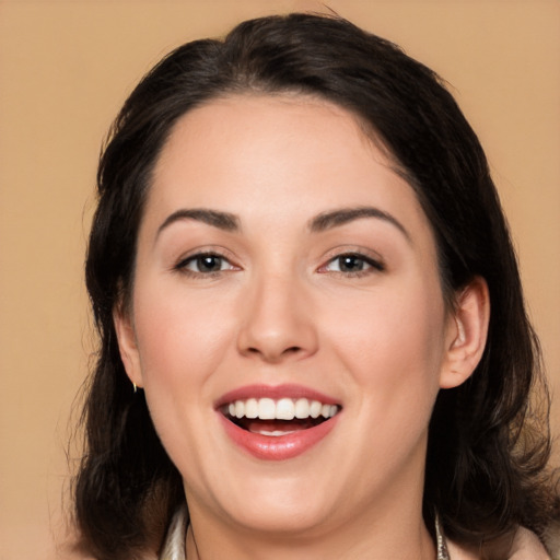 Joyful white young-adult female with medium  black hair and brown eyes