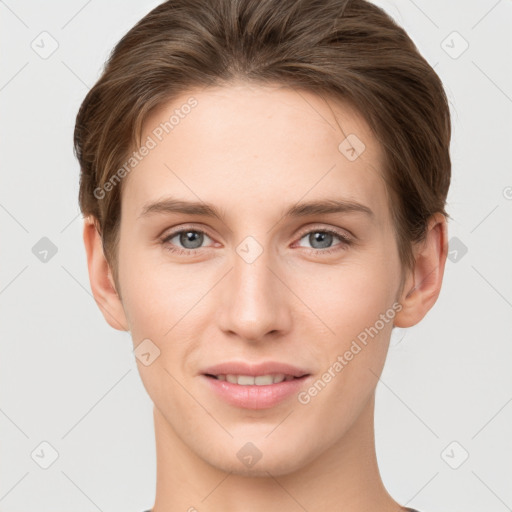 Joyful white young-adult female with short  brown hair and grey eyes