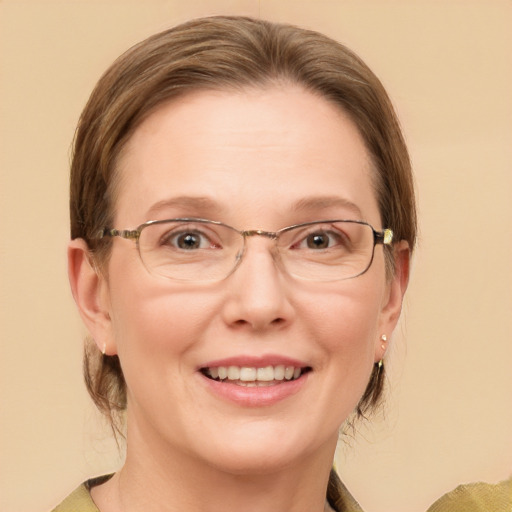 Joyful white adult female with medium  brown hair and blue eyes