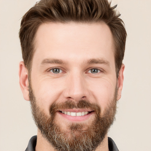 Joyful white young-adult male with short  brown hair and brown eyes