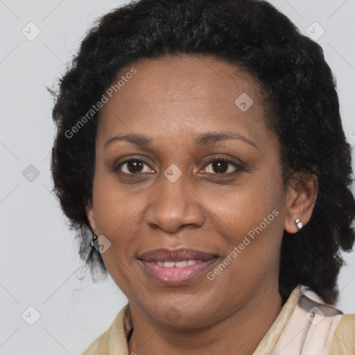 Joyful black adult female with medium  brown hair and brown eyes