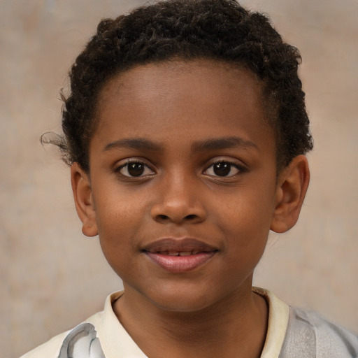 Joyful black child male with short  brown hair and brown eyes