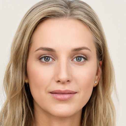 Joyful white young-adult female with long  brown hair and green eyes