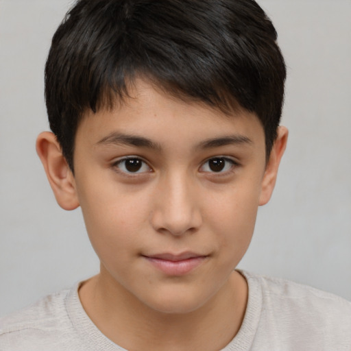 Joyful white child male with short  brown hair and brown eyes